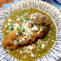 Chile Relleno with Pork Carnitas, black beans and Salsa Verde